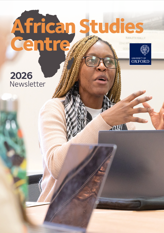 A student sat with a laptop in a seminar. She is gesturing and speaking to her classmates. Text above her head says: 'African Studies Centre, 2026 newsletter'