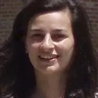Dr Kirvalidze has long dark hair and is smiling at the camera