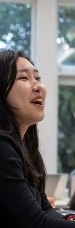 A group of students laughing in a seminar